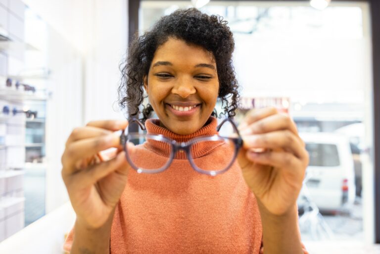 Female Customer Holding Pair Glasses